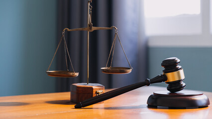 Business and lawyers discussing contract papers with brass scale on desk in office. Law, legal...