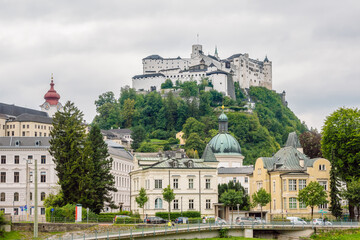 Fototapeta na wymiar View of the Fortress of Salzburg (Hohensalzburg) from the Salzach River, Salzburg , Austria.