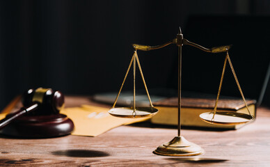 Business and lawyers discussing contract papers with brass scale on desk in office. Law, legal...