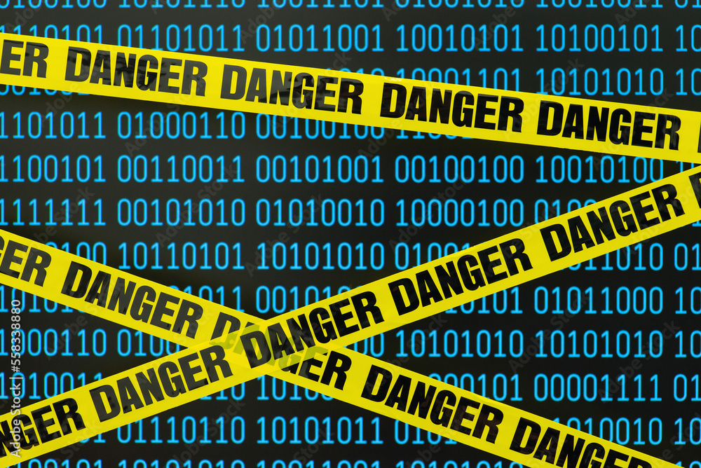 Poster yellow danger tape in front of computer screen with binary code. concept of information, online secu