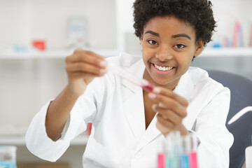 young attractive female scientist researching in the laboratory