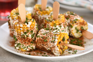 Delicious Indian of corn cob, also called Bhutta, flavored with butter, spices garam masala and...