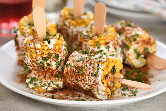 Delicious Indian of corn cob, also called Bhutta, flavored with butter, spices garam masala and cilantro
