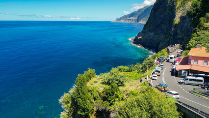 Naklejka premium Aerial view of Bidal Veil Waterfalls on a sunny morning in Madeira, Portugal