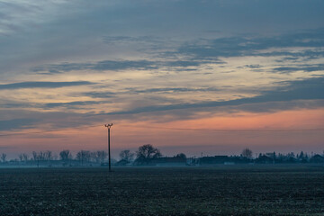 Fototapeta na wymiar Sunrise over the fields, colourful sky
