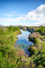 Fototapeta na wymiar Small blue pond in a rocky landsacpe