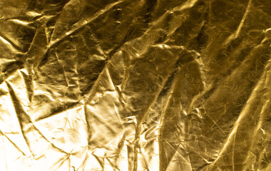 Fototapeta premium Crumpled Gold Fabric Texture Background, Wrinkled Bronze Pattern, Luxury Yellow Metallic Paper Mockup