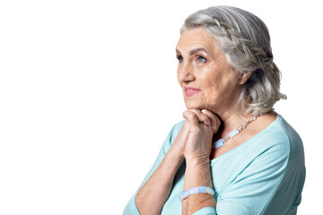 Beautiful senior woman posing against white background