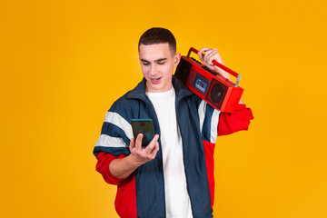 A handsome guy in the style of the 90s with a boombox on a yellow background