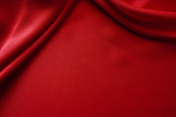 Fototapeta na wymiar red fabric texture empty as waves (spot focus)