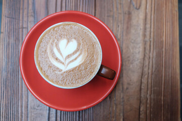 Cup of cappuccino on a wooden table