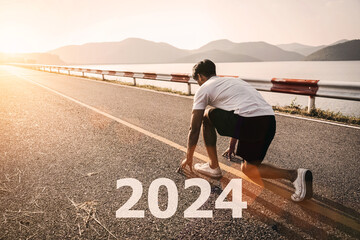 Young man asia running and sprinting on the road with new year 2024 text concept