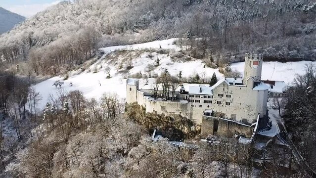 Aerial footage of Neu-Bechburg Castle in Oensingen in winter,  Switzerland