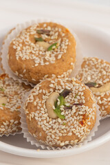 Winter Season Special Traditional Punjabi Mithai Til Tikki Or Tilkut Gud Mawa Bati Is Made Of Dry Roasted Sesame Seeds With Mava, Khoya, Jaggery, Gur, Desi Ghee Is Enjoyed On Makar Sankranti and Lohri