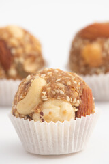 Indian Winter Delicacy White Ball Shaped Tilgul Laddu Or Safed Til Ki Laddo Is Made Of Roasted Sesame Seed, Jaggery, Gur, Gud, Makhana, Kaju, Badam Is Enjoyed In Winter On Makar Sankranti and Lohri