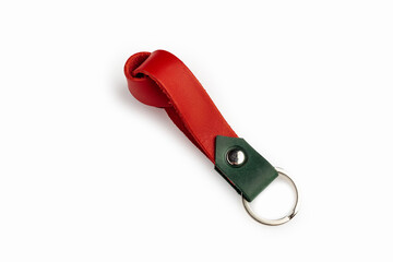 Red leather key chain isolated on white background.