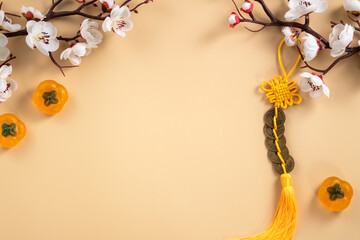 Chinese lunar new year background design concept with white plum flower and festive decoration.