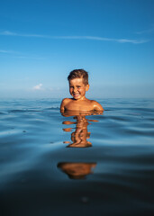 Portrait of a little boy in the sea