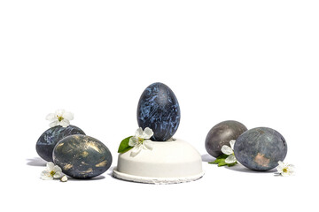 Easter egg on a beton stand isolated on white background. Traditional symbol, blooming cherry