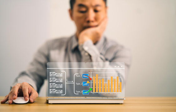 businessman look at screen show graphic about solution process in finance success in online data bar graph information in business technology concept