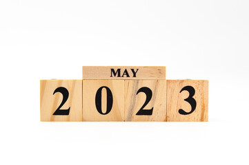 May 2023 written on wooden blocks isolated on white background with copy space