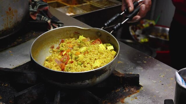 cooking Maggie noodles in Shimla or Simla capital of Himachal Pradesh north India Himalayas. 