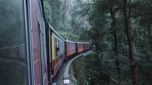 Toy train running from Kalka to Shimla or Simla capital of Himachal Pradesh north India Himalayas. Indian mountain railway