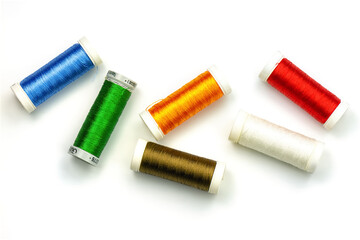 Multicolored sewing threads isolated on white background. Color thread spools on white background,...