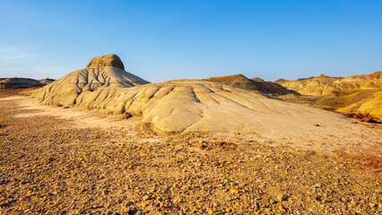Sunrise over the barren badlands in the UNESCO World Heritage Site of Dinosaur Provincial Park,...