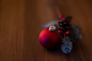 Candle for the 1st Advent and Christmas. Decoration with red Advent candle, fir branches, cones,...