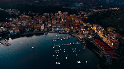 Top view of the small town of Porto Ercole, Tuscany Italy at sunset. Harbor with boats, fishing...