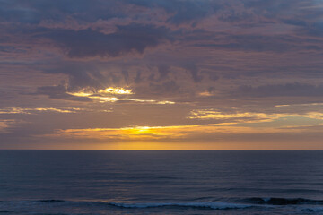 Colorful sunrise, with clouds, over the sea