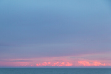 Sunset sky over the sea with cold colors