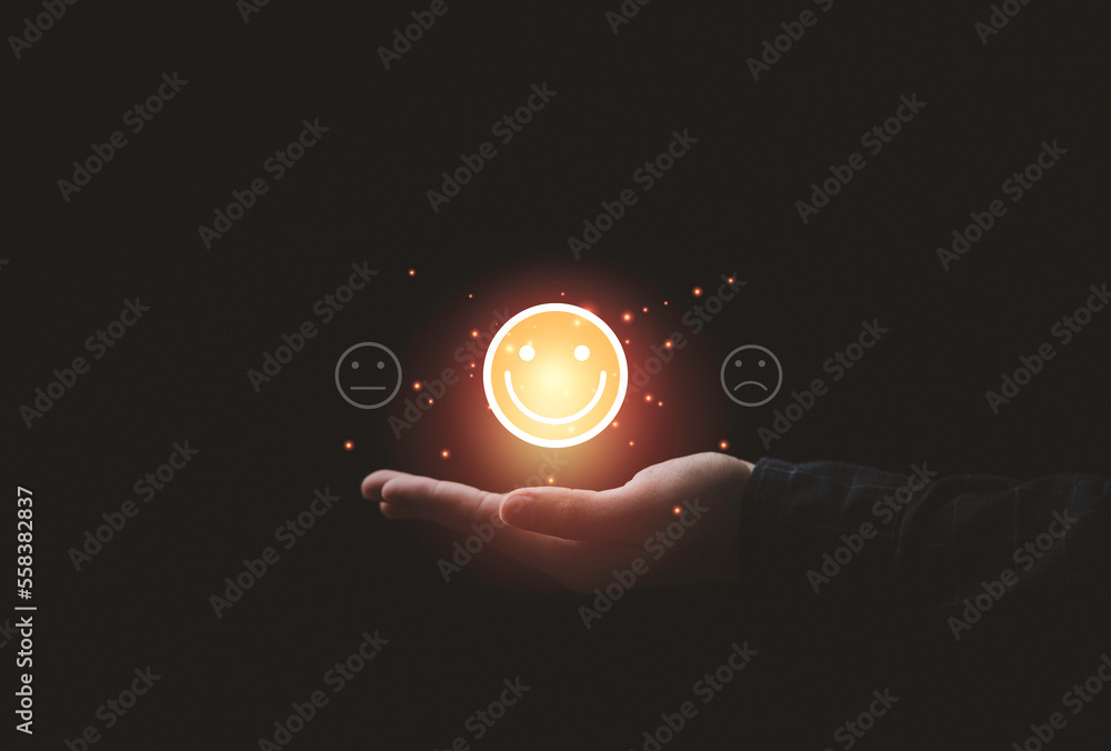 Poster Hand holding to select smile face icon for client evaluation and customer satisfaction after use product and service concept.