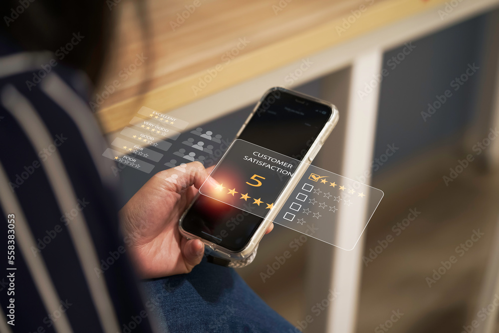 Poster Woman using smartphone for select five stars for client evaluation and customer satisfaction after use product and service concept.