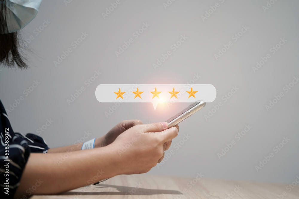 Poster Woman using smartphone for select five stars for client evaluation and customer satisfaction after use product and service concept.