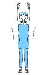 ストレッチで背伸びするエプロンを着たシニア女性