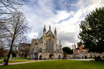 The entrance to The Cathedral Church of the Holy Trinity, Saint Peter, Saint Paul and Saint Swithun (Winchester Cathedral) in Winchester, UK