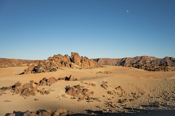 The deserted volcanic landscape of Minas de San José, rocks, sand and tourists under the moon in the Teide National Park on the island of Tenerife