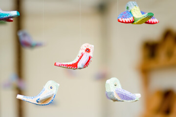 Cute colorful wooden birds sold on Easter market in Vilnius.