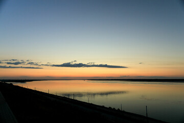 Fototapeta na wymiar Calm sunset Volga bright Yar, calm evening on the river