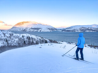 Fototapeta na wymiar Woman skiing in the Velfjord mountains,Helgeland,Norway,Europe