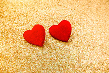 Heart symbol on a gold shiny background
