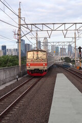 Fototapeta premium KRL Commuterline, or known as Commuterline, is a commuter rail system for Greater Jakarta in Indonesia. It was previously known as KRL Jabodetabek. It is operated by PT KAI Commuter Indonesia