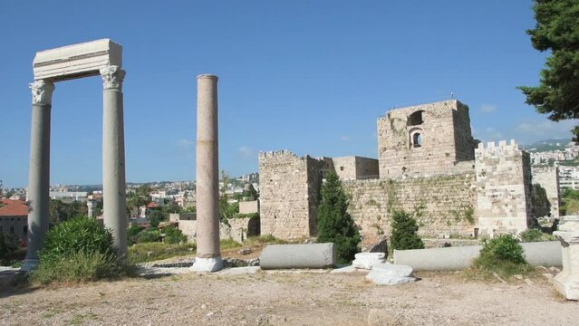 Left to right panning on Roman colonnade and Byblos citadel, Crusader castle, Jbeil, Lebanon	
