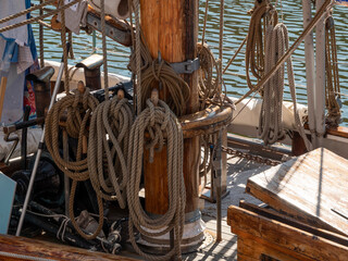 Large thick ropes on the mast of a large sailing ship