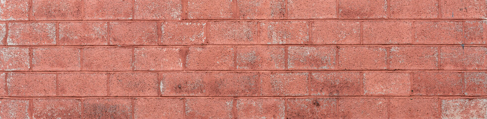 Painted and weathered long brick wall background panorama, graphic resource, horizontal aspect
