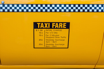 Taxi fares displayed on the side of a yellow cab in New York City in the1990s.