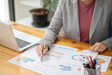 Calculating Cost Economic budget saving and investment concept analyzing investment charts and calculator Accounting Concept