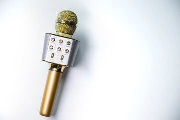 Golden microphone on white background isolated 
